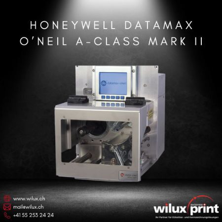 Nahaufnahme des Honeywell Datamax O'Neil A-Class Mark II Etikettendruckmoduls für die Industrie mit einem Metallgehäuse, LCD-Display und Sichtfenster, geeignet für den Thermodirekt- und Thermotransferdruck in industriellen Anwendungen.