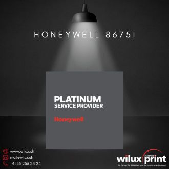 Das Bild zeigt das Platinum Service Provider Logo von Honeywell, das die Partnerschaft von WILUX für den Honeywell 8675i Wearable Scanner hervorhebt. Ein Spotlight betont das Logo und die Akkreditierung.