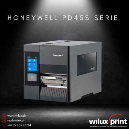 Honeywell PD45S Etikettendrucker für Industrie in dunklem Gehäuse, mit LCD-Display und offenem Etikettendruckfach. Unterstützt Thermodirekt- und Thermotransferdruck für industrielle Anwendungen.