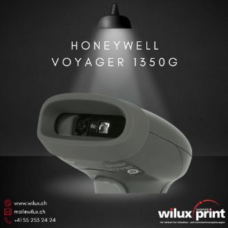 Nahaufnahme des Honeywell Voyager 1350g Area Imager Scanners in Schwarz unter einer beleuchteten Lampe. Der Scanner ist für die Erfassung von 1D- und 2D-Barcodes ausgelegt und zeichnet sich durch seine kompakte Bauweise aus.