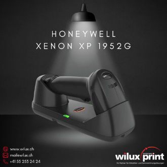 Kabelloser Honeywell Xenon XP 1952g Barcode-Scanner in Schwarz, liegend in seiner Basisstation unter einer beleuchteten Lampe, ideal für Einzelhandel und Lagerlogistik.