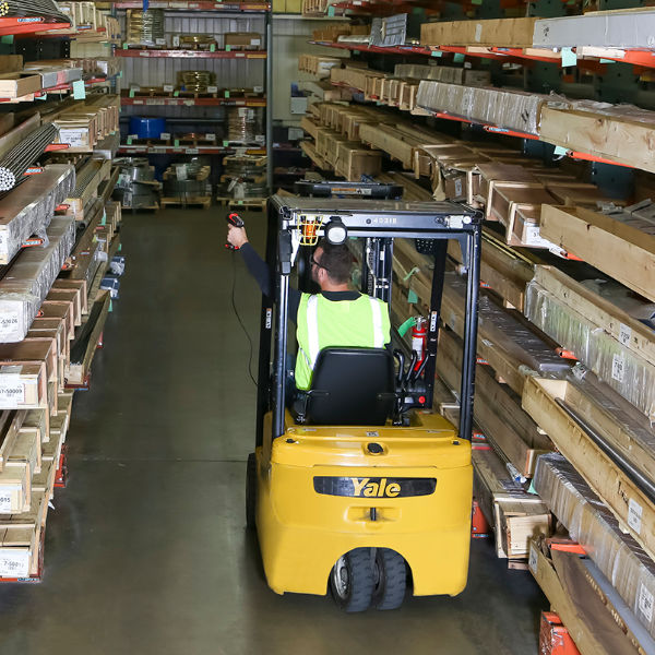 Warehouse worker on a Yale forklift scanning goods with the Honeywell Granit XP 1991iXR - outstanding performance in demanding environments.